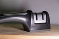 Kitchen knife sharpener sharpening tool countertop tool metal slots handle grip two stage sharpener Royalty Free Stock Photo