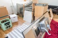 Kitchen laid out in the living room, disassembled into individual parts