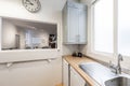 kitchen with light wood countertop stainless steel sink under window Royalty Free Stock Photo