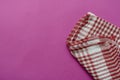 Kitchen linen towel folded on a color table Royalty Free Stock Photo