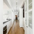 Kitchen in long apartment corridor Royalty Free Stock Photo