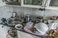 Kitchen mess. Kitchenware, pile of dirty untidy utensils in sink washbasin Royalty Free Stock Photo