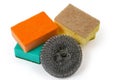 Kitchen metal and colored synthetic sponges on a white background