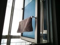 Kitchen microfiber cloth drying at the window mounted aluminium and pvc pipe towel rack. Home DIY project hack to the window