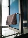 Kitchen microfiber cloth drying at the window mounted aluminium and pvc pipe towel rack. Home DIY project hack to the window