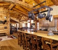 The kitchen and wet bar in a modern log home. Royalty Free Stock Photo