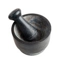 Kitchen mortar and pestle made of dark stone, isolated on a white background, close-up, spices Royalty Free Stock Photo