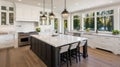 Kitchen in new luxury home with quartz waterfall island, hardwood floors, dark wood cabinets, and stainless steel Royalty Free Stock Photo