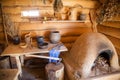 Kitchen in the old peasant log cabin Royalty Free Stock Photo