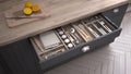 Kitchen opened drawer full of kitchenware