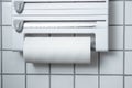 A kitchen paper towel roll hanging on the wall in the kitchen Royalty Free Stock Photo