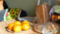 Oranges and bread on the table