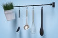 Kitchen rack on blue wall