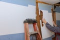 Kitchen renovation in progress with removed old sheetrock preparing for new cabinet installation Royalty Free Stock Photo