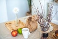 Kitchen in rustic style in summer. Spring light textured kitchen with an old fridge, wooden table. A wooden tray with a vase, will Royalty Free Stock Photo