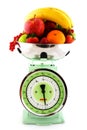 Kitchen scale with diversity of fruit Royalty Free Stock Photo