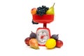 Kitchen scale and fruit isolated on white background Royalty Free Stock Photo