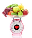 Kitchen scale with fruits and vegetables Royalty Free Stock Photo