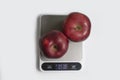 Kitchen scales, apple calorie a light background