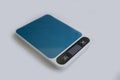 Kitchen scales on a colored background calculate Royalty Free Stock Photo