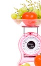 Kitchen Scales with fresh tomatoes and grapes Royalty Free Stock Photo