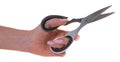 Kitchen scissors in female hand Royalty Free Stock Photo