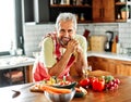 kitchen senior portrait man healthy home elderly happy food organic diet vegetable recipe cooking fresh meal dieting Royalty Free Stock Photo