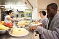 Kitchen Serving Food In Homeless Shelter Royalty Free Stock Photo