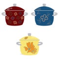 Kitchen set dishes. Three enameled pots for cooking red blue yellow with a pattern on a white background Royalty Free Stock Photo