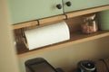 Kitchen shelf with paper towel holder and items Royalty Free Stock Photo