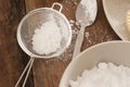 Kitchen sieve filled with icing sugar