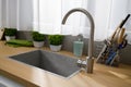 Kitchen sink, faucet and other kitchen utensils. Royalty Free Stock Photo