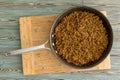 Kitchen skillet filled with cooked ground beef