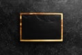 Kitchen slate black board. On a black stone background. Royalty Free Stock Photo