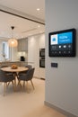 Kitchen smart home control panel for easy management showing kitchen and dining area interface for modern home integration Royalty Free Stock Photo