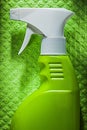 Kitchen sprayer on green dishrag Royalty Free Stock Photo