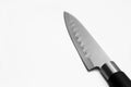 Kitchen steel sharp knife with a black handle on a gray background. Side view. Royalty Free Stock Photo