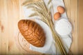 Kitchen still life from flour, wheat ears, bread and eggs Royalty Free Stock Photo