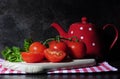 Kitchen still life with tomatos and tea pot