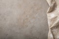 Kitchen stone table with towel. Top view with copy space. Concrete beige background with a touch of rust Royalty Free Stock Photo