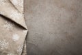 Kitchen stone table with towel. Top view with copy space. Concrete beige background with a touch of rust Royalty Free Stock Photo