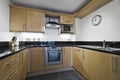 Kitchen with stone worktop Royalty Free Stock Photo