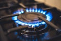 Kitchen stove cook. Kitchen gas cooker with burning blueflames fire propane gas. Royalty Free Stock Photo