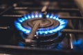 Kitchen stove cook. Kitchen gas cooker with burning blueflames fire propane gas. Royalty Free Stock Photo