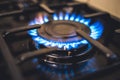 Kitchen stove cook. Kitchen gas cooker with burning blueflames fire propane gas. Royalty Free Stock Photo