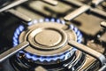 Kitchen stove cook. Kitchen gas cooker with burning blueflames fire propane gas. Royalty Free Stock Photo