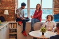 Group of interracial students resting in student dormitory.