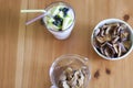 Kitchen table. A bowl of dried apples, a glass of blueberry yogurt Royalty Free Stock Photo