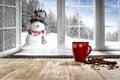 Kitchen table with christmas decorations and blurred kitchen background. Royalty Free Stock Photo