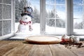 Kitchen table with christmas decorations blurred kitchen background. Royalty Free Stock Photo